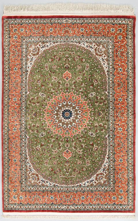 A silk Qum rug, circa 152 x 101 cm.