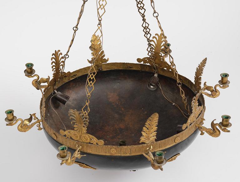 A presumably Russian Empire gilt and patinated bronze nine-branch chandelier, 19th century.