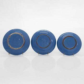 Marita Lybeck, a set of three ceramic plates and cream jug, red clay, signed ML.