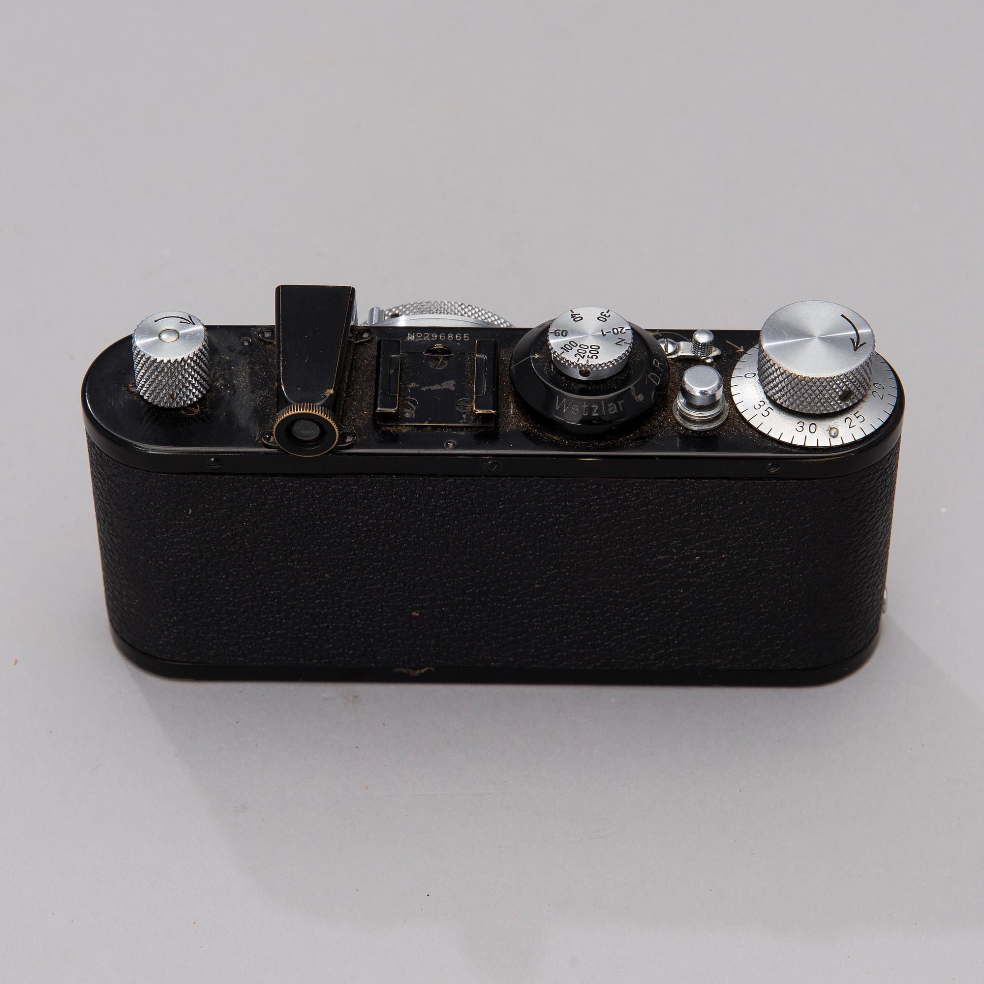 A black body Leica camera no 296865 with a Elmar lens made in 1938