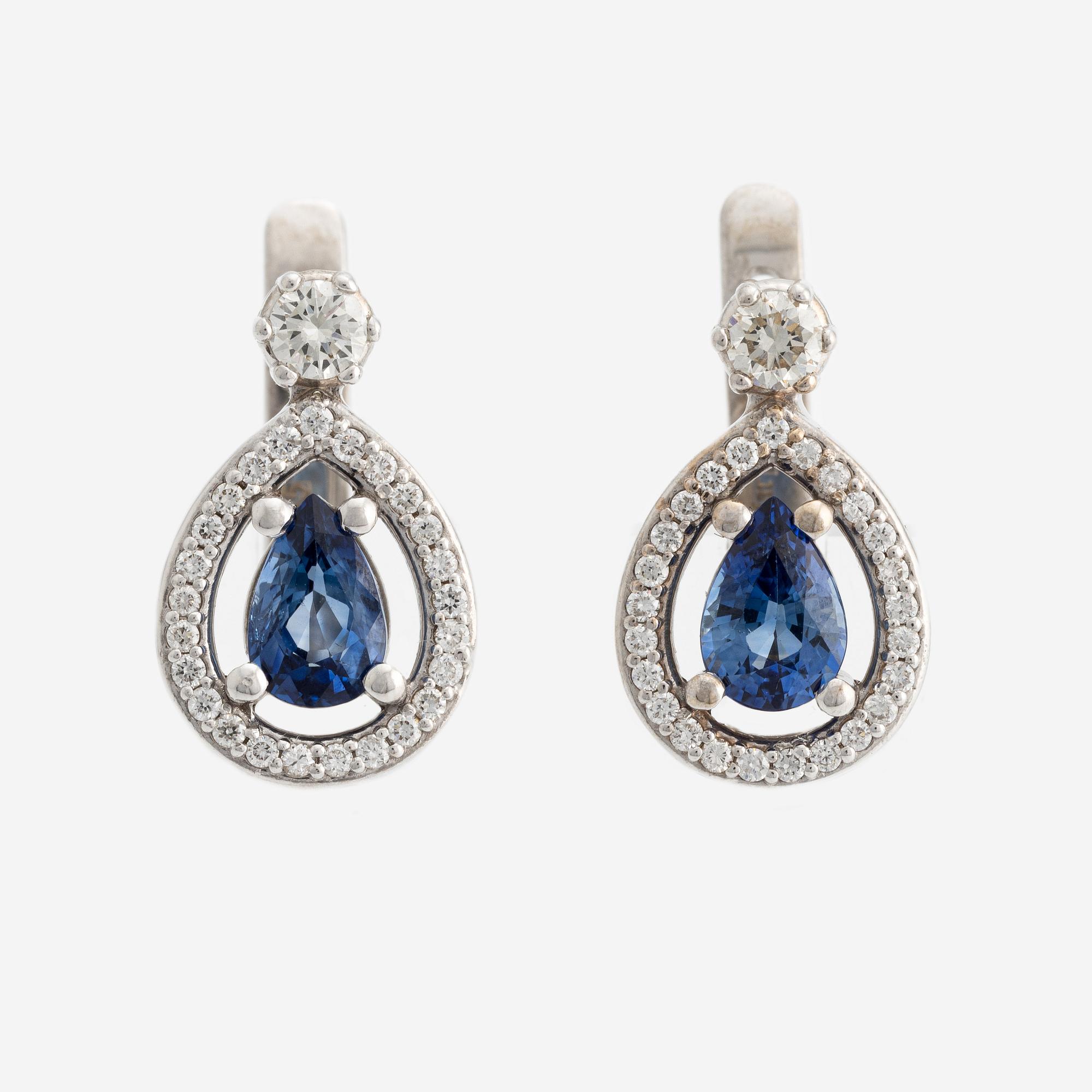 A pair of 14K gold earrings with faceted sapphires and round brilliant-cut diamonds.