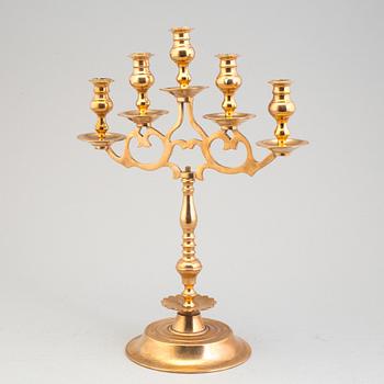 A pair of brass baroque style candelabra, early 20th century.