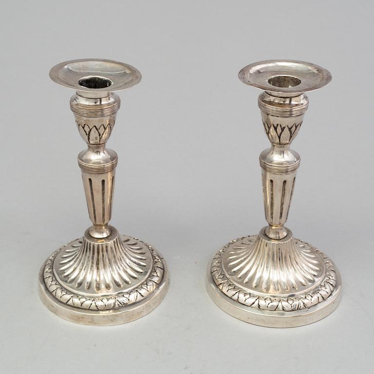 A pair of late 18th century silver candlesticks with unclear hallmarks, possibly from Germany. Weight ca 316 grams.