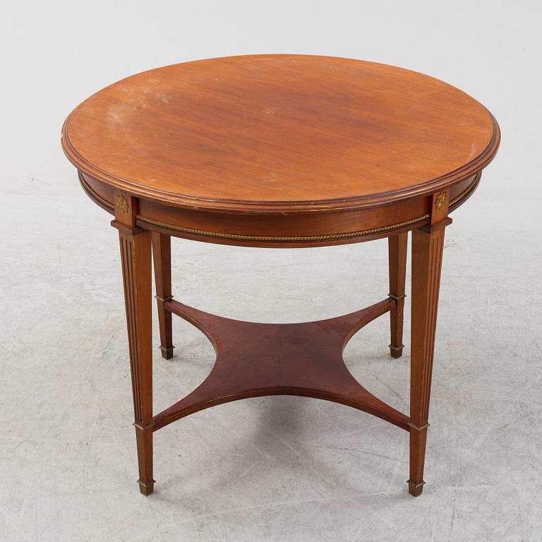 An Empire style table, a sofa and eight chairs, early 20th Century.