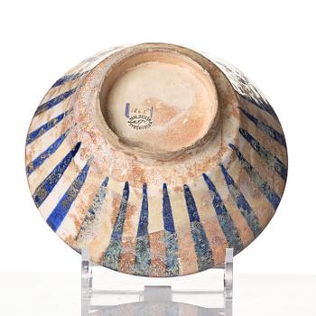 A cobalt glazed radila design pottery bowl, Persia (Iran), 12th/13th century.