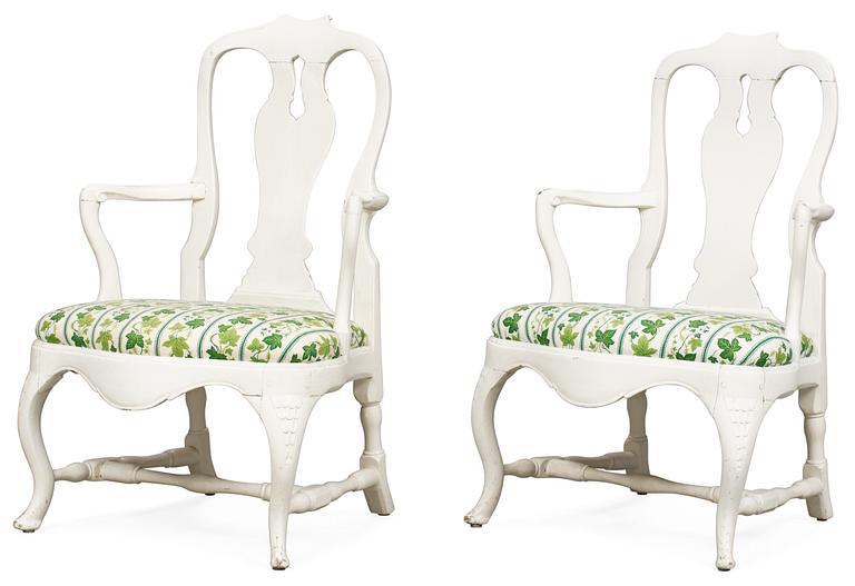Two matched Swedish Rococo armchairs.