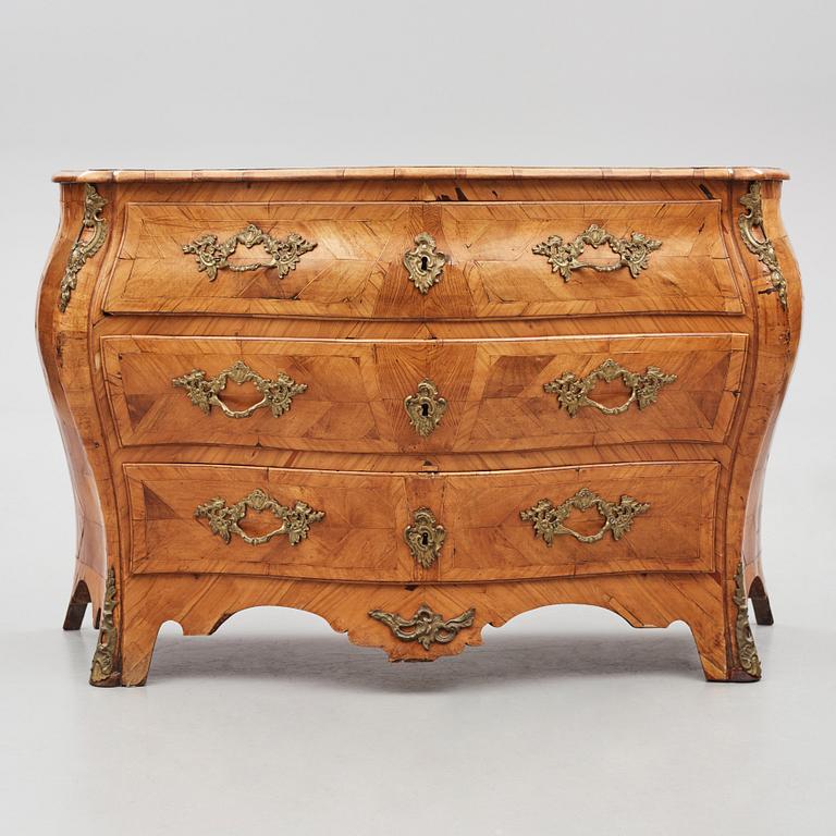 A brass-mounted and marquetry rococo commode, later part of the 18th century.