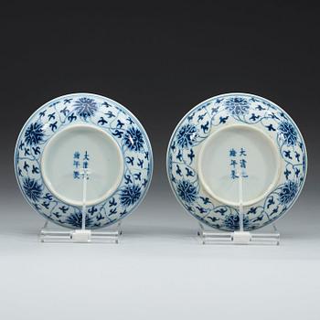 A pair of blue and white lotus dishes, Qing dynasty, Guangxu mark and period (1874-1908).