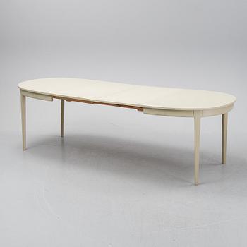 A dining table with six chairs by Carl Malmsten, second half of the 20th Century.