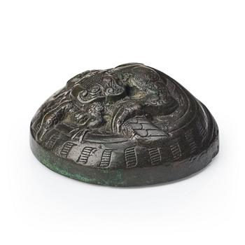 A bronze dragon a and bird weight, Warring states (475–221 BC).