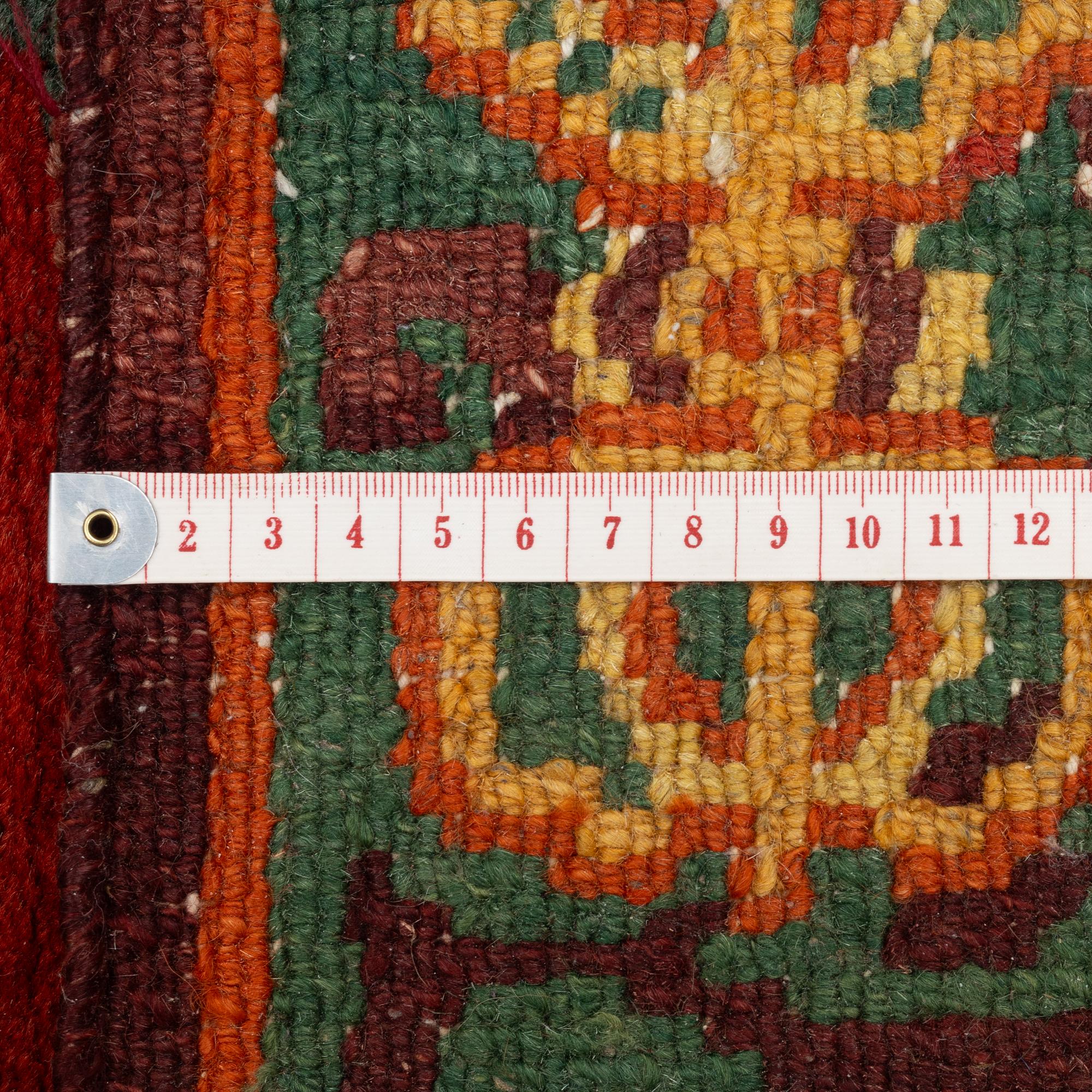 A Nepalese rug, c. 157 x 91cm.