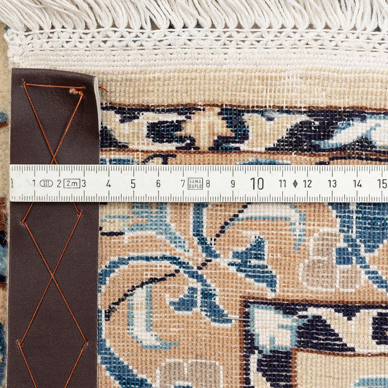 A carpet, Nain, part silk, fine 9 laa, signed, ca 327 x 210 cm.