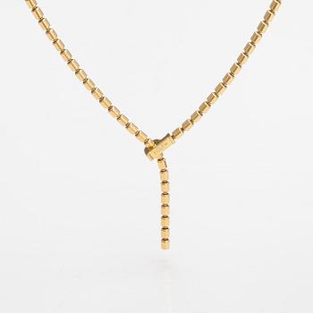 Piaget, An 18K gold "Possession" necklace with diamonds ca. 0.17 ct in total. Marked Piaget D18828.