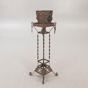 A metal pedestal and urn early 1900s.