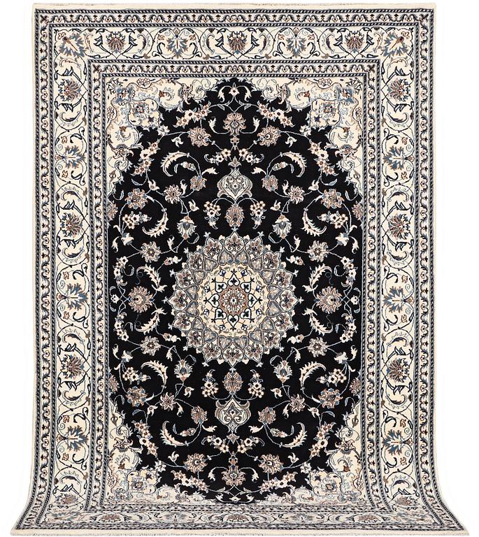 A carpet, Nain, part silk, ca 307 x 198 cm.
