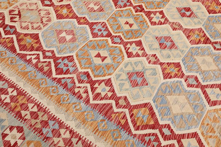 A Kilim carpet, approx. 392 x 309 cm.
