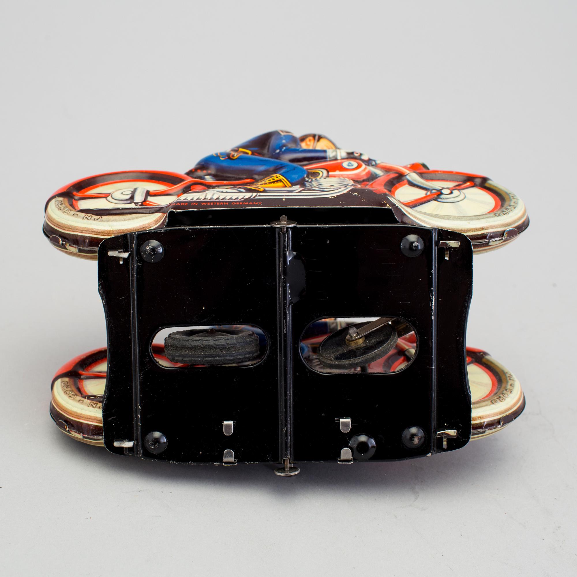 A tinplate synchronous motorcycle by Philipp Niedermeier, Germany, 1950s.