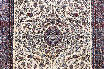 An oriental carpet, c. 308 x 220 cm.