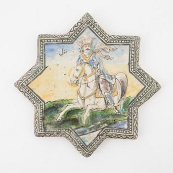 A Persian (Iranian) tile, glazed pottery, Qajar dynasty, 19th century.