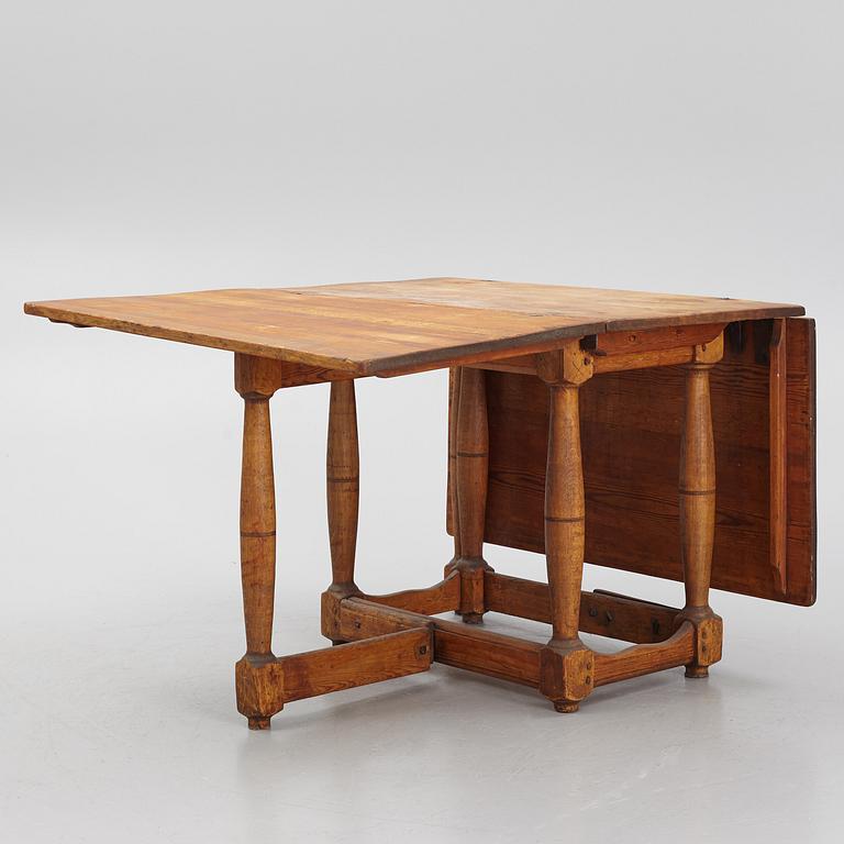 A drop-leaf table, 18th Century.