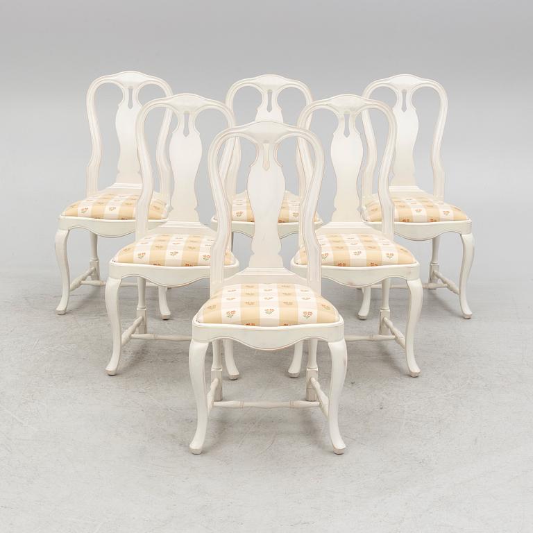 A Rococo style dining table and six chair, late 20th Century.