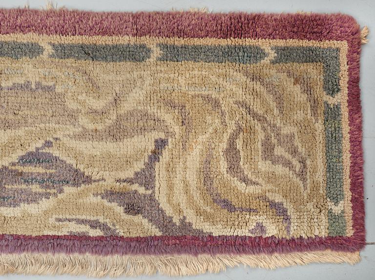 KNOTTED TEXTILE. "Vättervågor". Flossa variant (hand-knotted). Designed by Selma Giöbel around 1910.