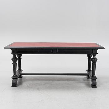 A renaissance style library table, around 1900.