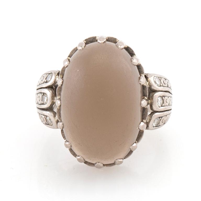 Ring 18K white gold with diamonds and cabochon-cut grey moonstone, Gunnar Fahlström Stockholm 1953.