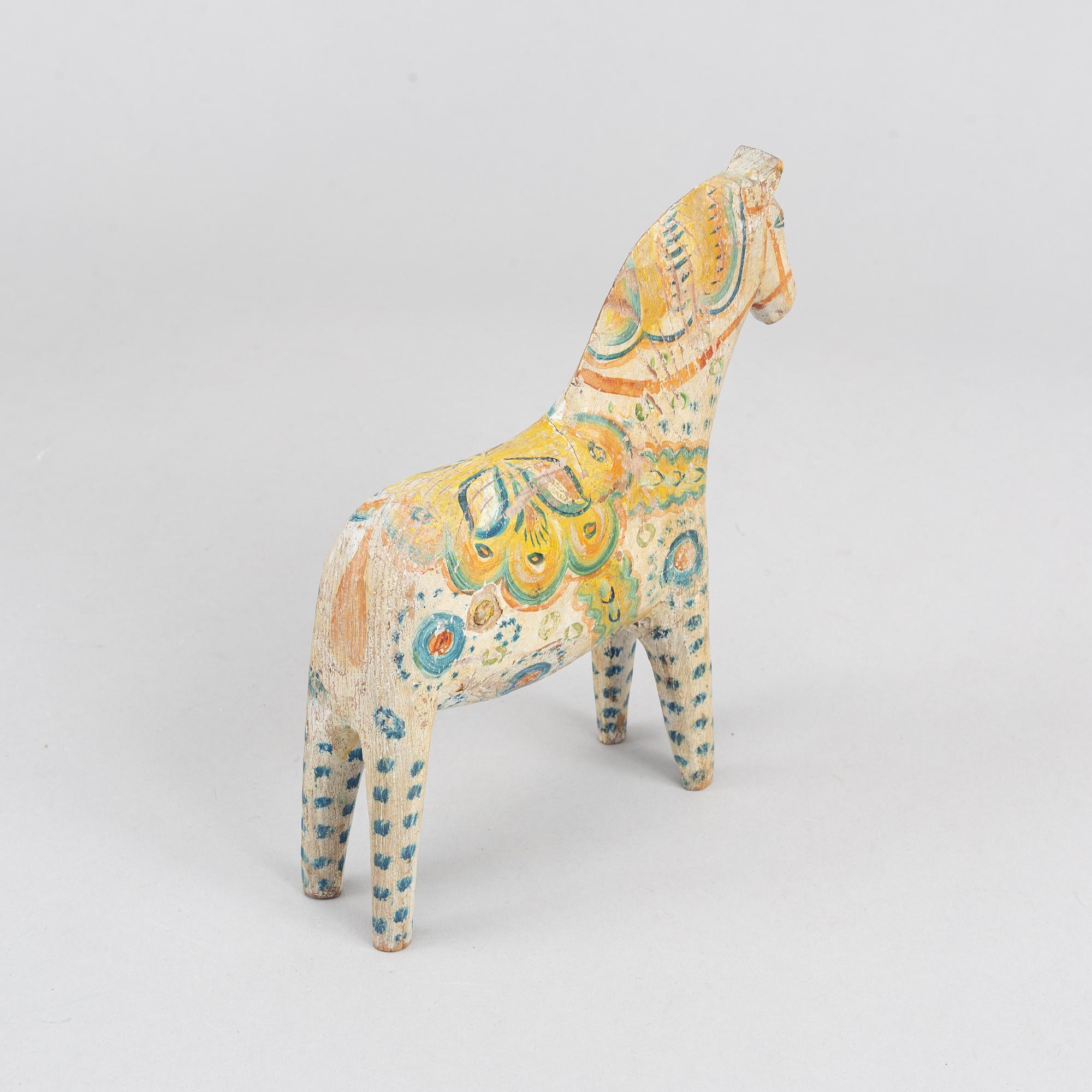 A painted Swedish wooden horse from the first half of the 20th century.