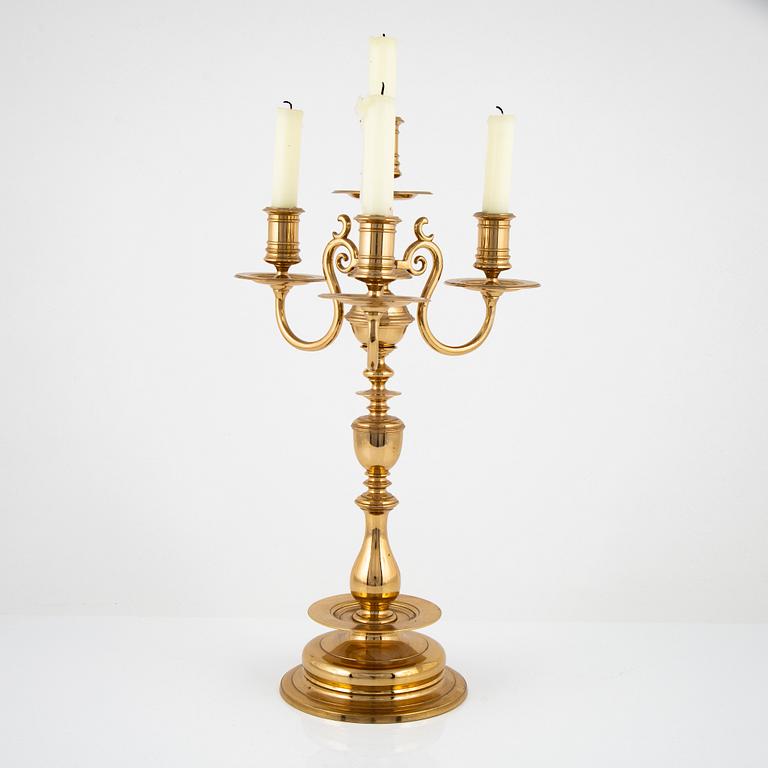 A brass four-light candelabra from Gusums Bruk, first part of the 20th Century.