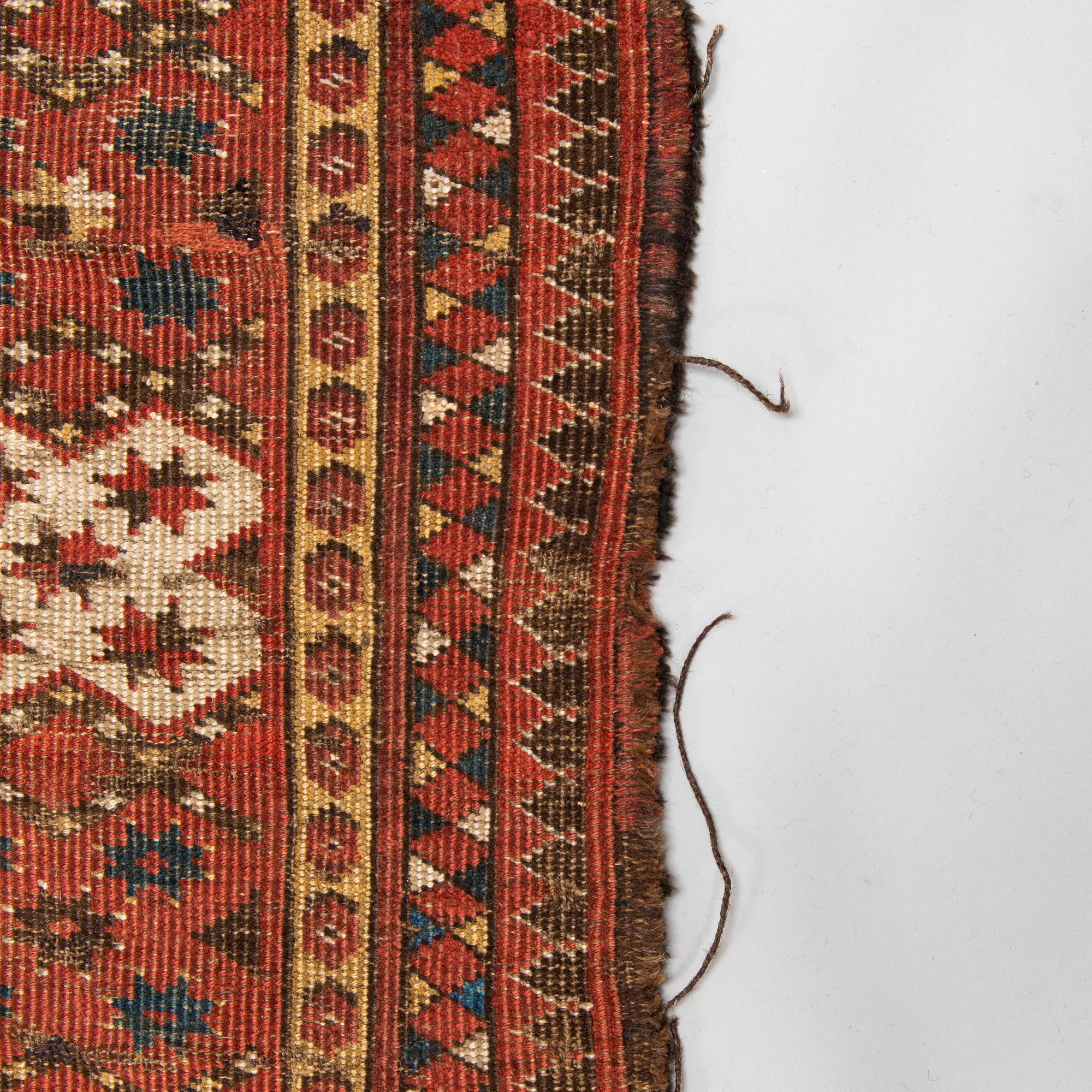 An Antique Beshir carpet, ca 183 x 390 cm.
