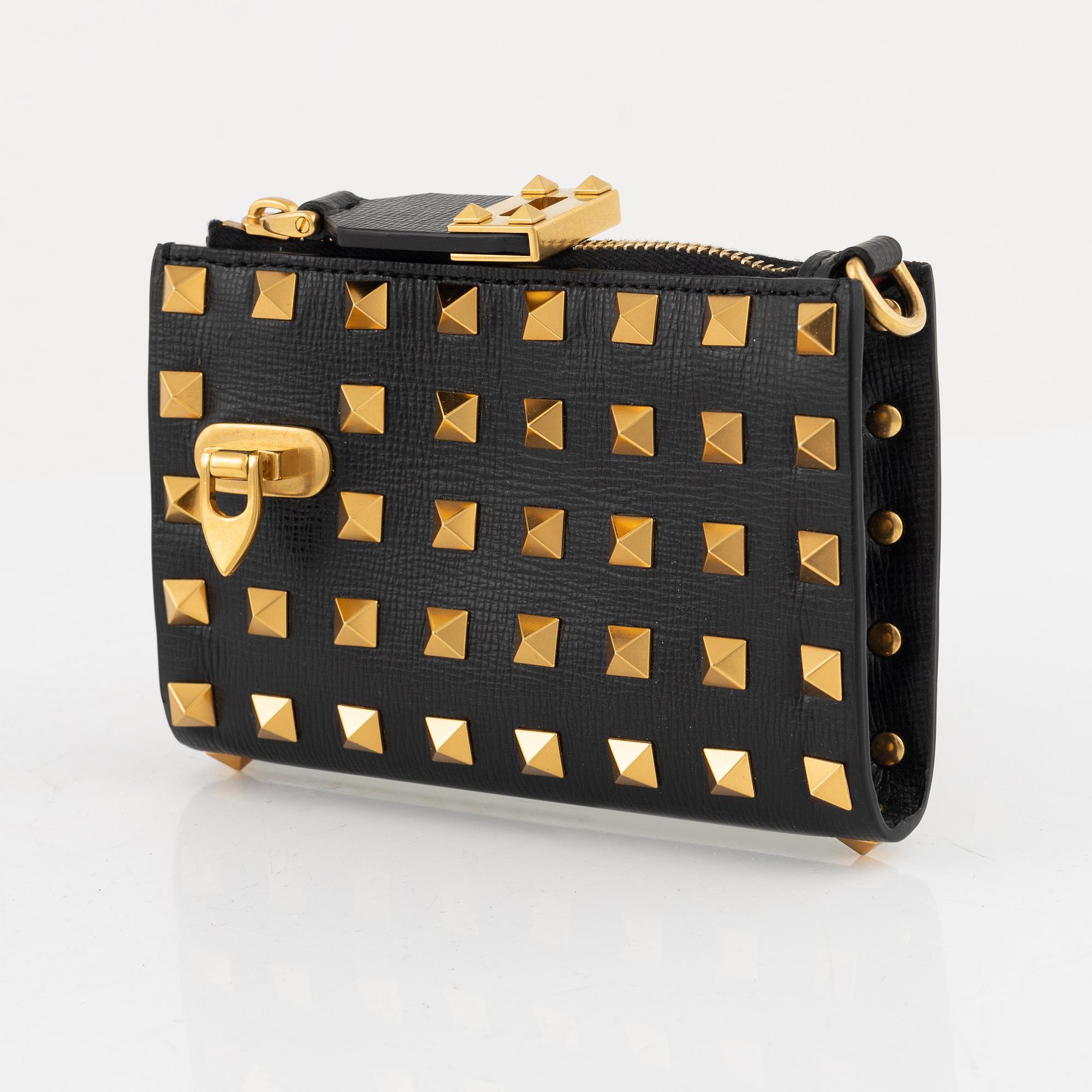 Valentino Garavani, a leather and studs wallet.