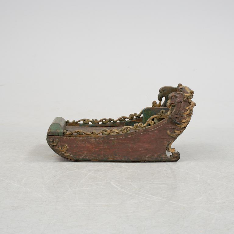 A childrens sleigh middle european dated 1709.