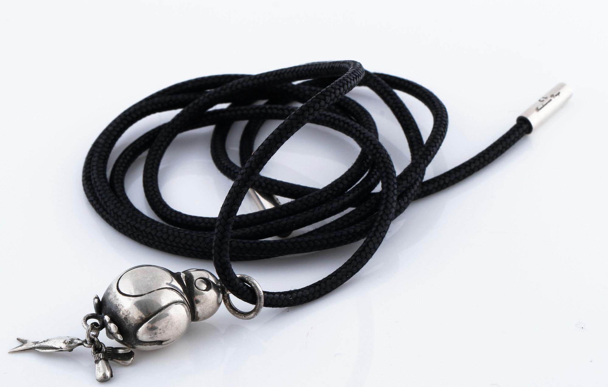 A pendant, "My friend" by Ole Lynggaard.