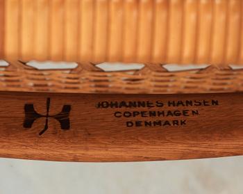 A Hans J Wegner oak and rattan folding chair, by Johannes Hansen, Denmark.