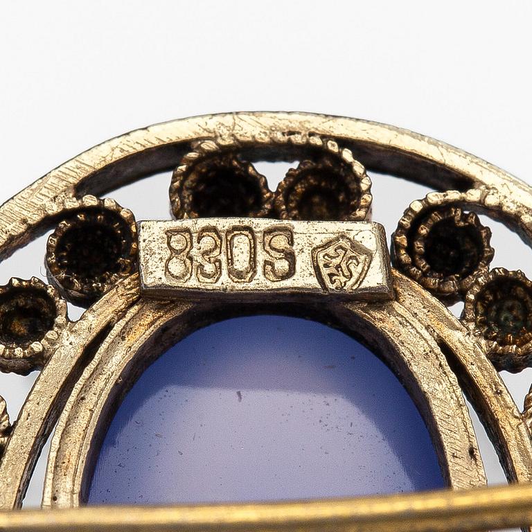 Brooch, cabochon-cut moonstones, gilded silver.