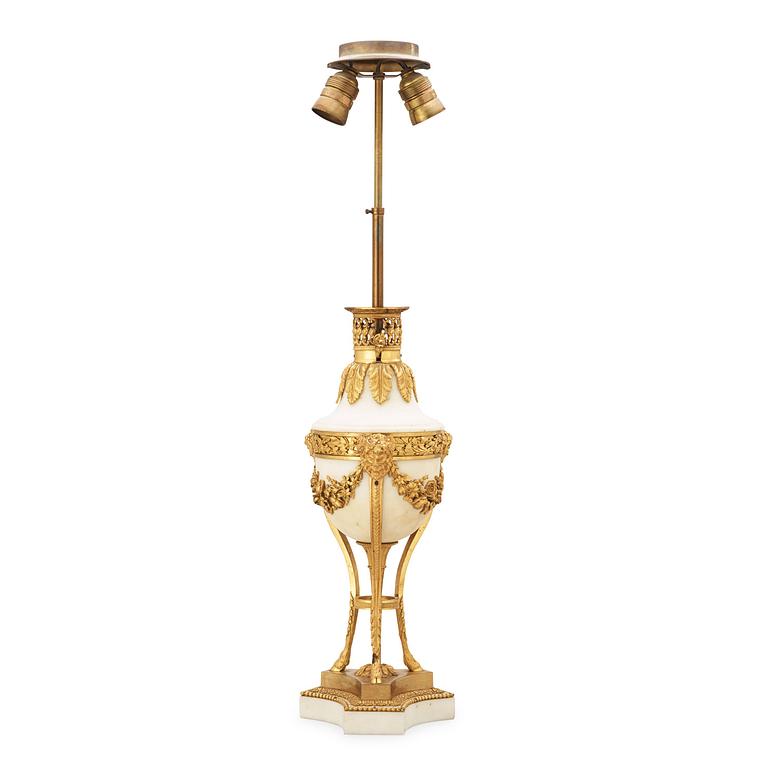 A French Louis XVI-style late 19th century table lamp.