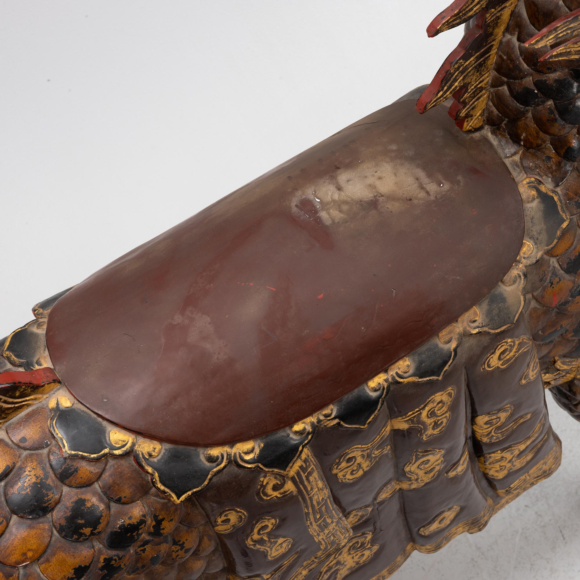 A pair of large Qilin sculptures, lacquered wood, first part of the 20th century.