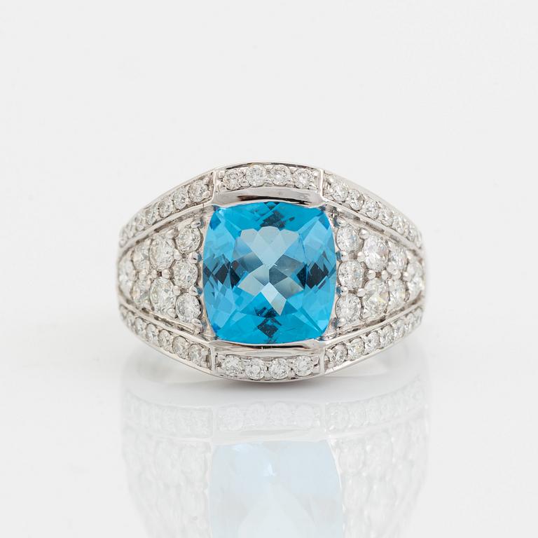 Blue topaz and brilliant cut diamond ring.