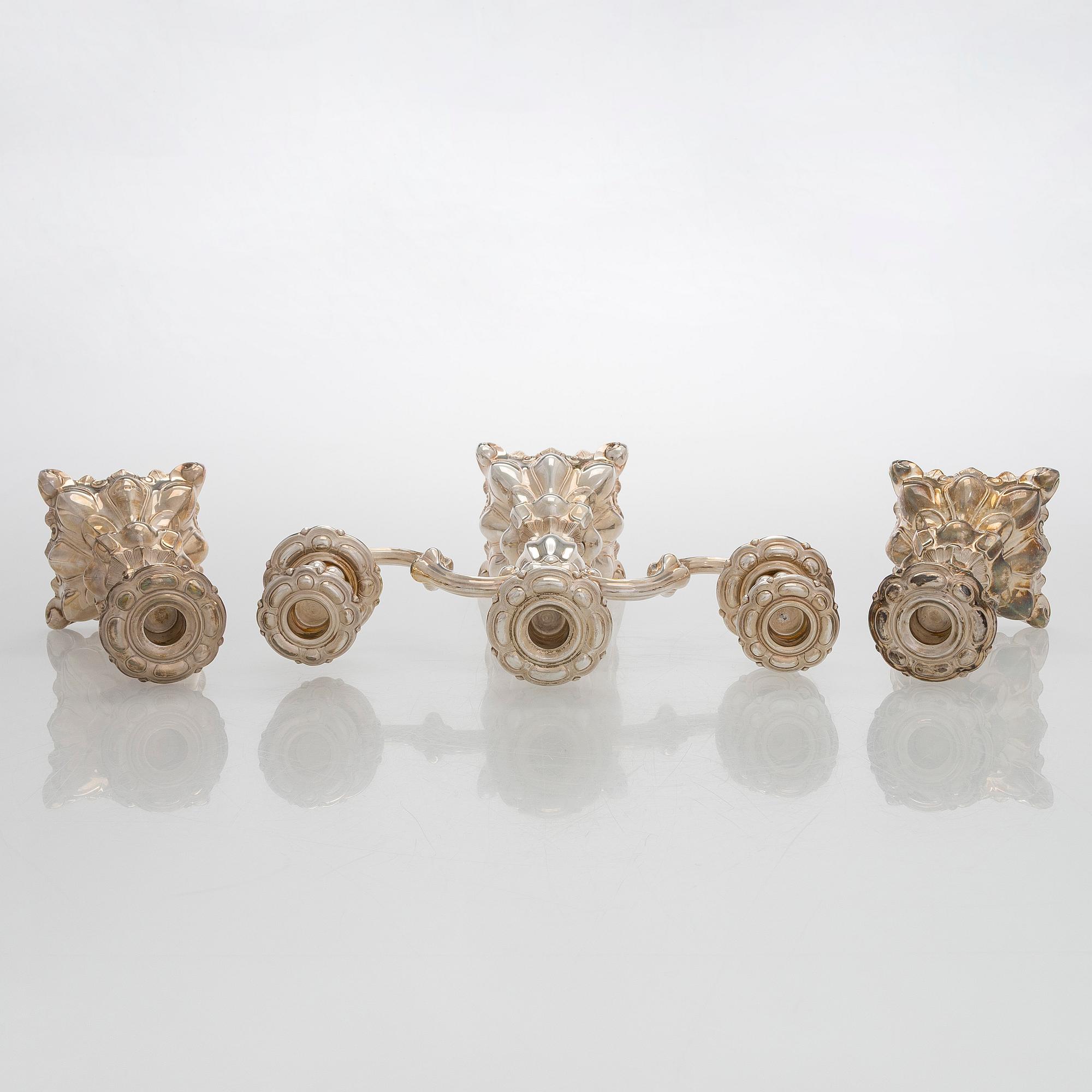 A silver candelabra and a pair of silver candlestick, Kultakeskus Hämeenlinna 1962 and 1985.