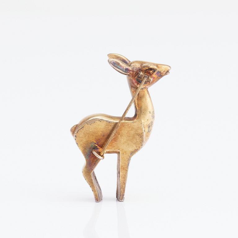 Estrid Ericson, a gilt pewter brooch of a deer, Svenskt Tenn, Sweden.