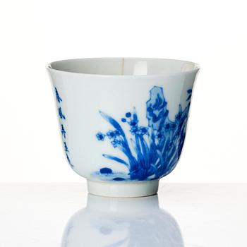 A blue and white month cup 'Narcissus', late Qing dynasty with Kangxi mark.