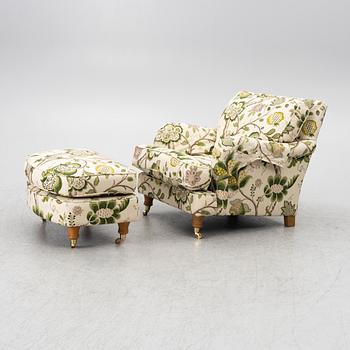 A 'Howard' armchair with footstool, Englesson.