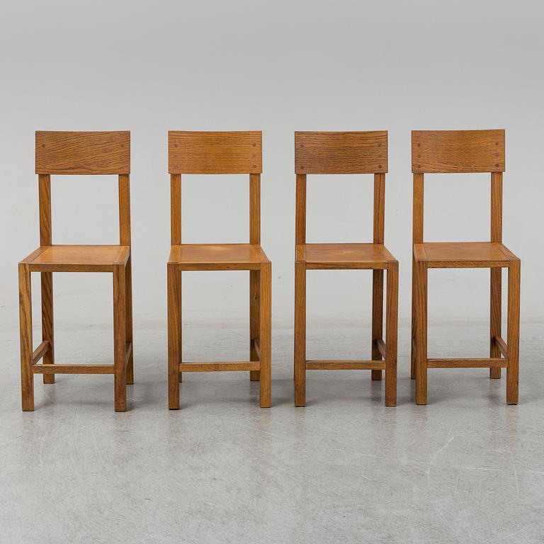 MARIO PRANDINA, an oak table and four chairs, Plinio Il Giovane, Italy.