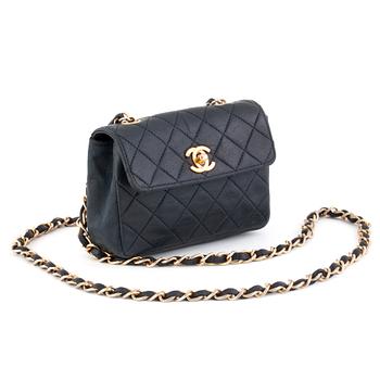 CHANEL, a black quilted leather shoulderbag, "Mini flap bag".