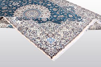 A carpet, Nain, part silk, 6 Laa, ca 312 x 208 cm.