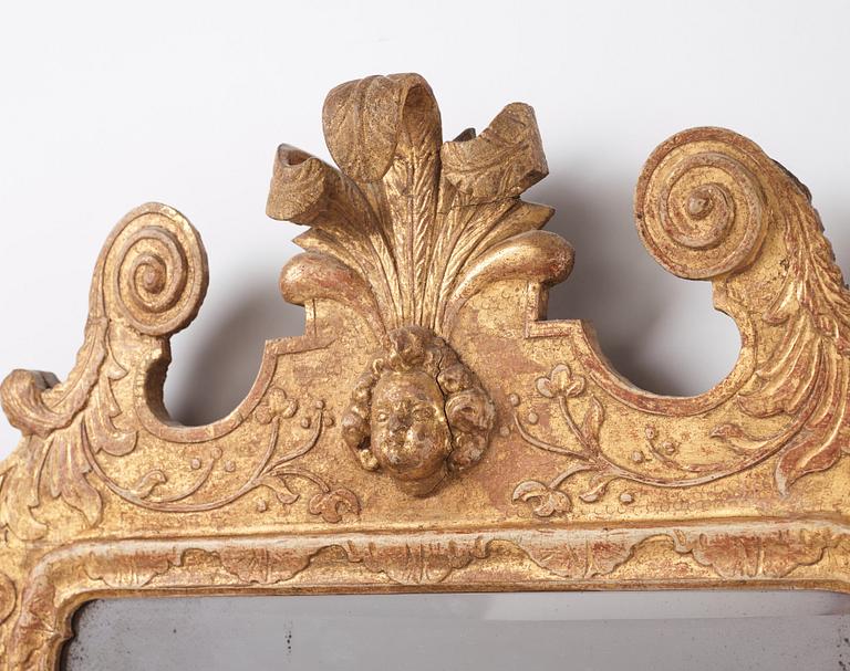 A Northern-European late Baroque two-light giltwood mirror sconce, first part of the 18th century.