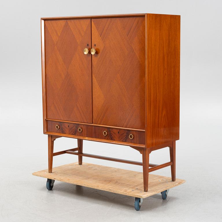 A mahogany veneered cabinet, 1940s/50s.