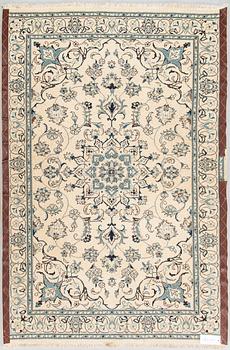 A carpet, Nain Part Silk. Ca 185 x 123 cm.