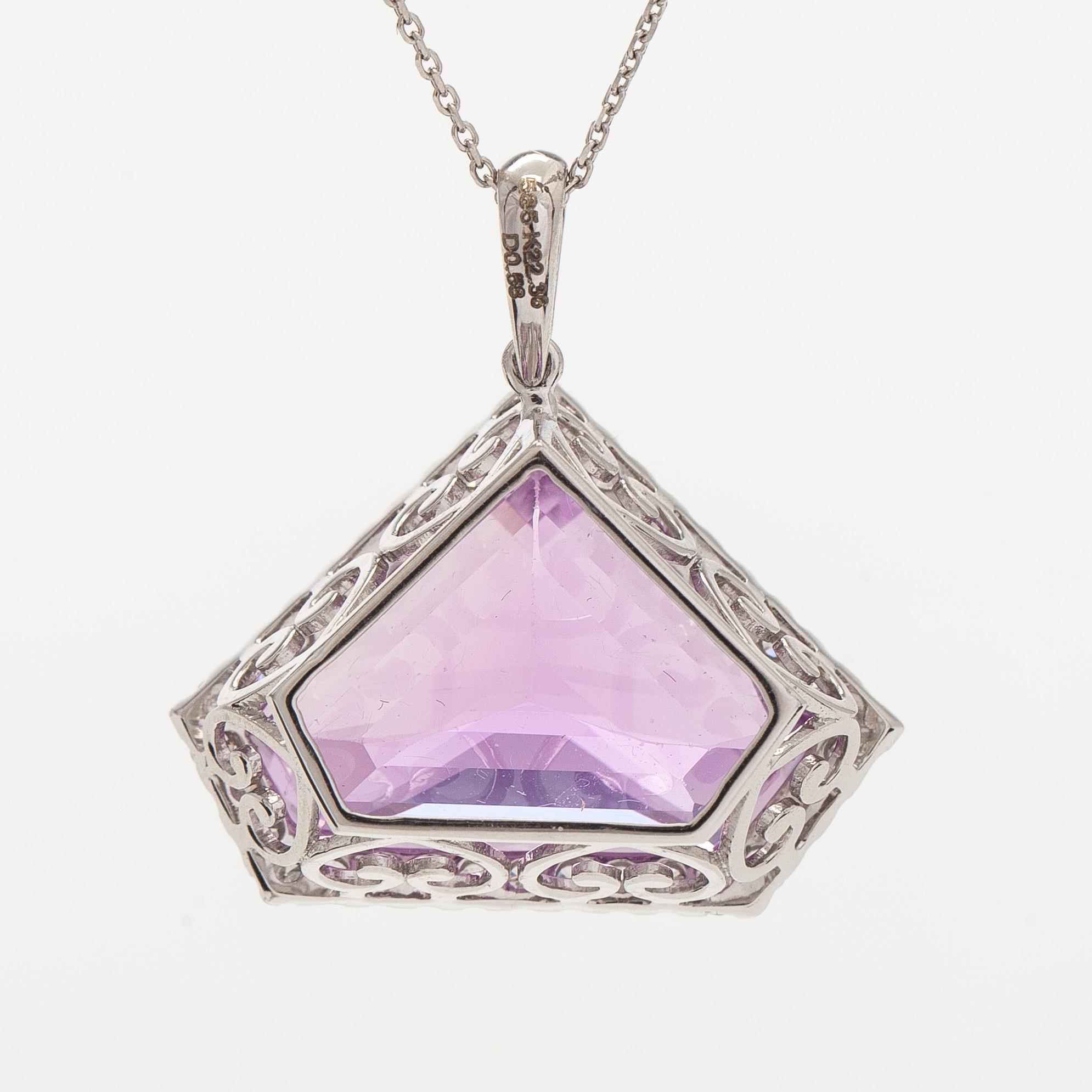 A 14K gold necklace with kunzite and brilliant cut diamonds.